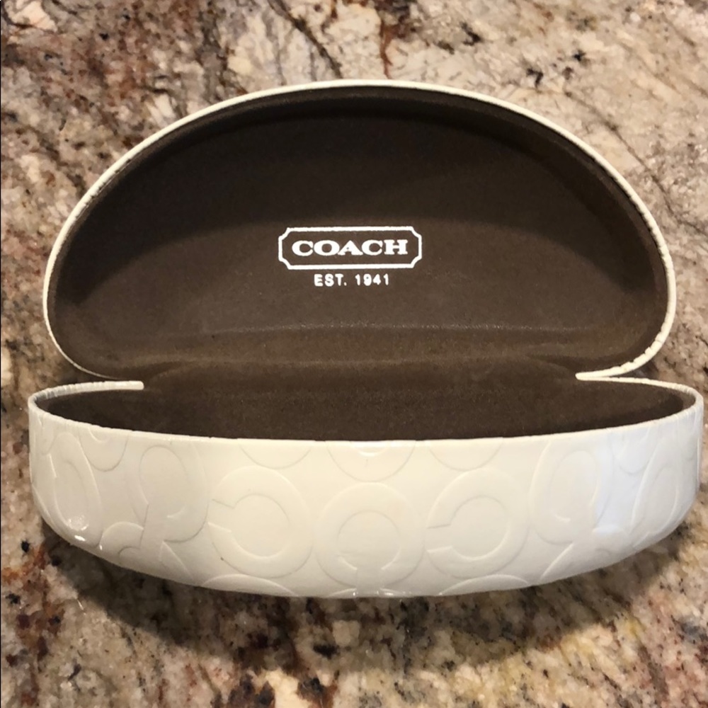 Used Coach clam shell sunglasses case.